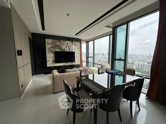 Luxurious high-rise living room with stunning city view and elegant dining area.