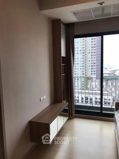Modern bedroom with balcony view in urban apartment
