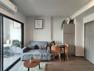 Modern living room with cozy sofa, dining area, and stylish decor in a contemporary apartment.