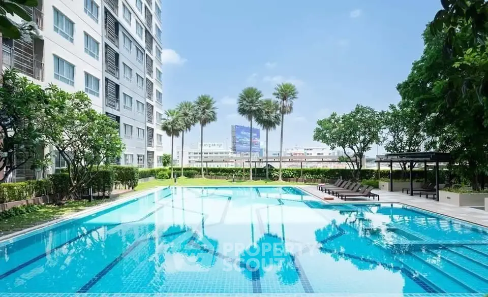 Luxurious condominium with stunning pool and lush greenery, perfect for relaxation and leisure.