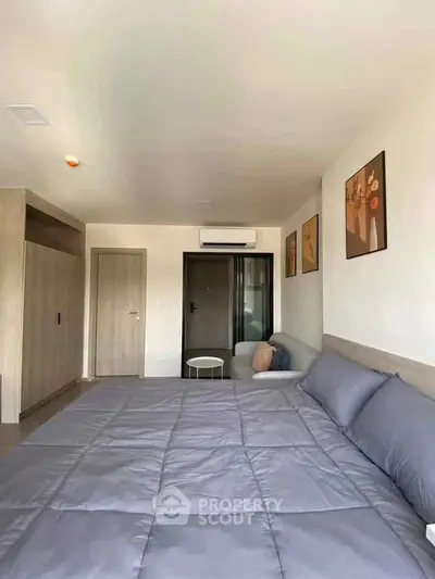 Spacious modern bedroom with stylish decor and cozy ambiance