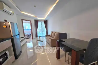 Modern living room with sleek design and balcony view