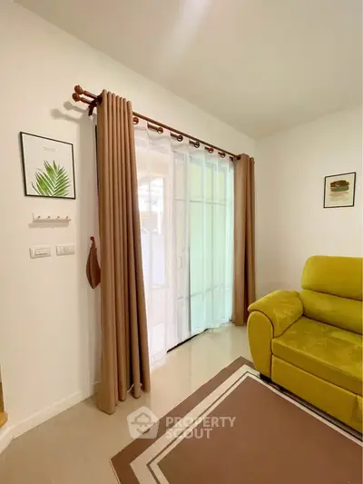 Cozy living room with vibrant yellow sofa and elegant curtains
