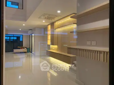 Modern living room with sleek built-in shelves and ambient lighting