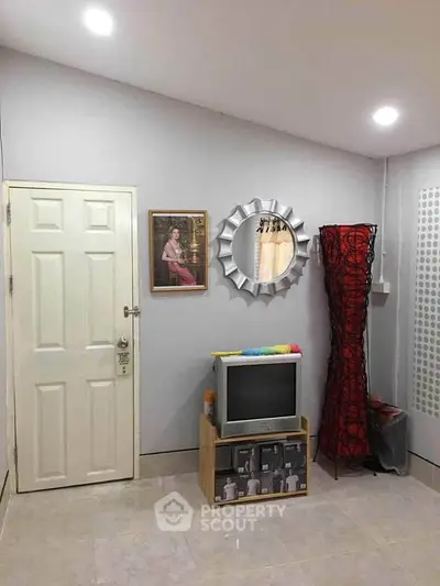 Cozy living room with vintage TV and stylish decor accents