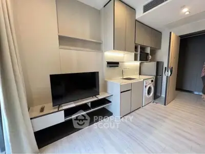 Modern apartment interior with sleek kitchen and integrated appliances