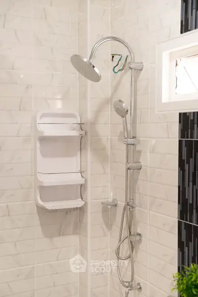 Modern bathroom with sleek shower fixtures and elegant tile design.