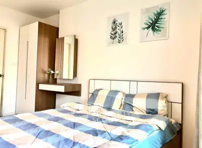 Cozy bedroom with modern decor and stylish furniture, perfect for relaxation and comfort.