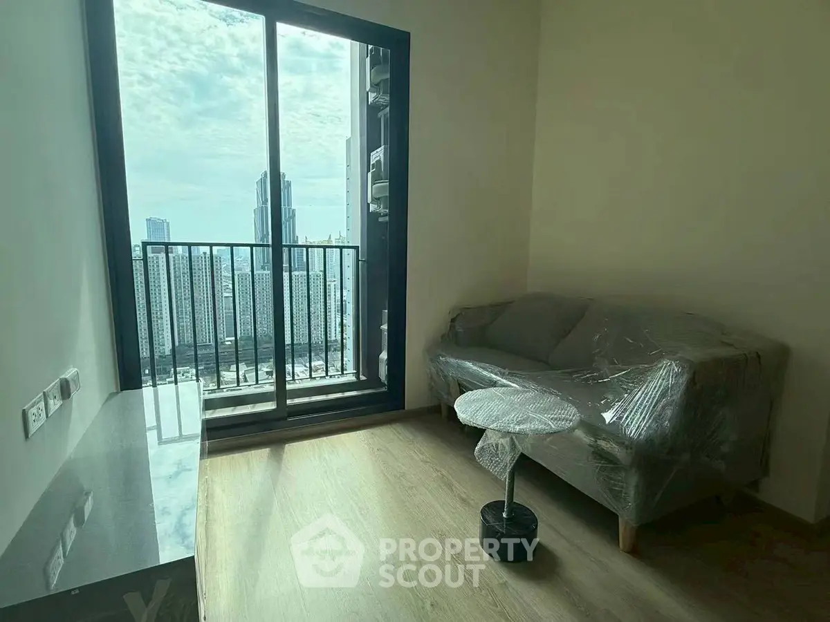 Modern living room with balcony view in high-rise apartment