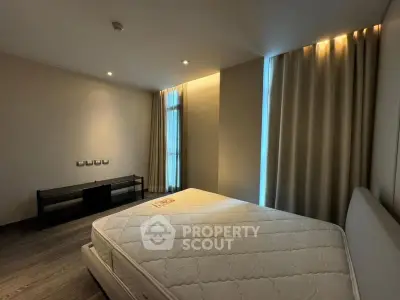 Spacious bedroom with modern design and ample natural light