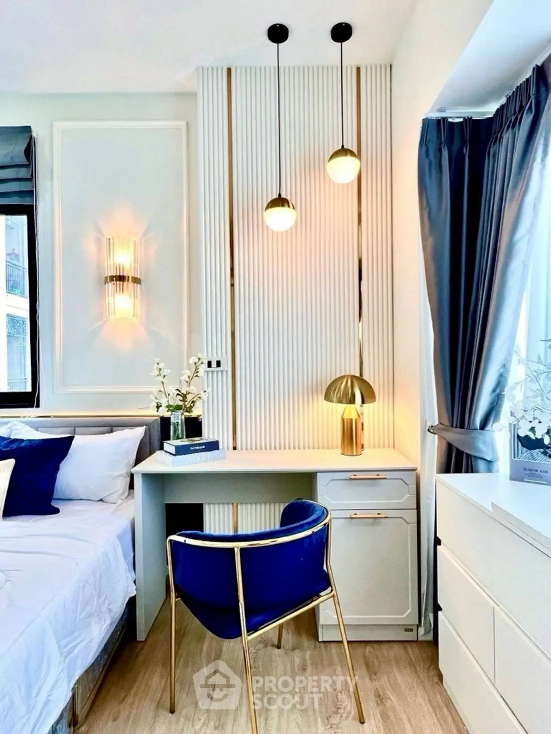 Chic modern bedroom with elegant desk, stylish lighting, and cozy decor