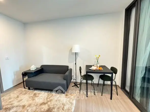 Modern living room with cozy sofa and dining area in stylish apartment