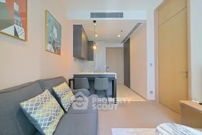 Modern living room with open kitchen layout and stylish decor