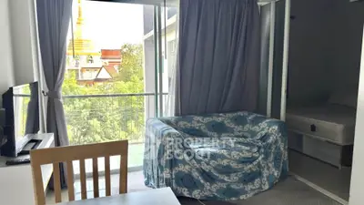 Cozy living room with balcony view and stylish furniture