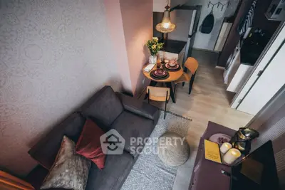 Charming compact living room with cozy dining area and modern decor