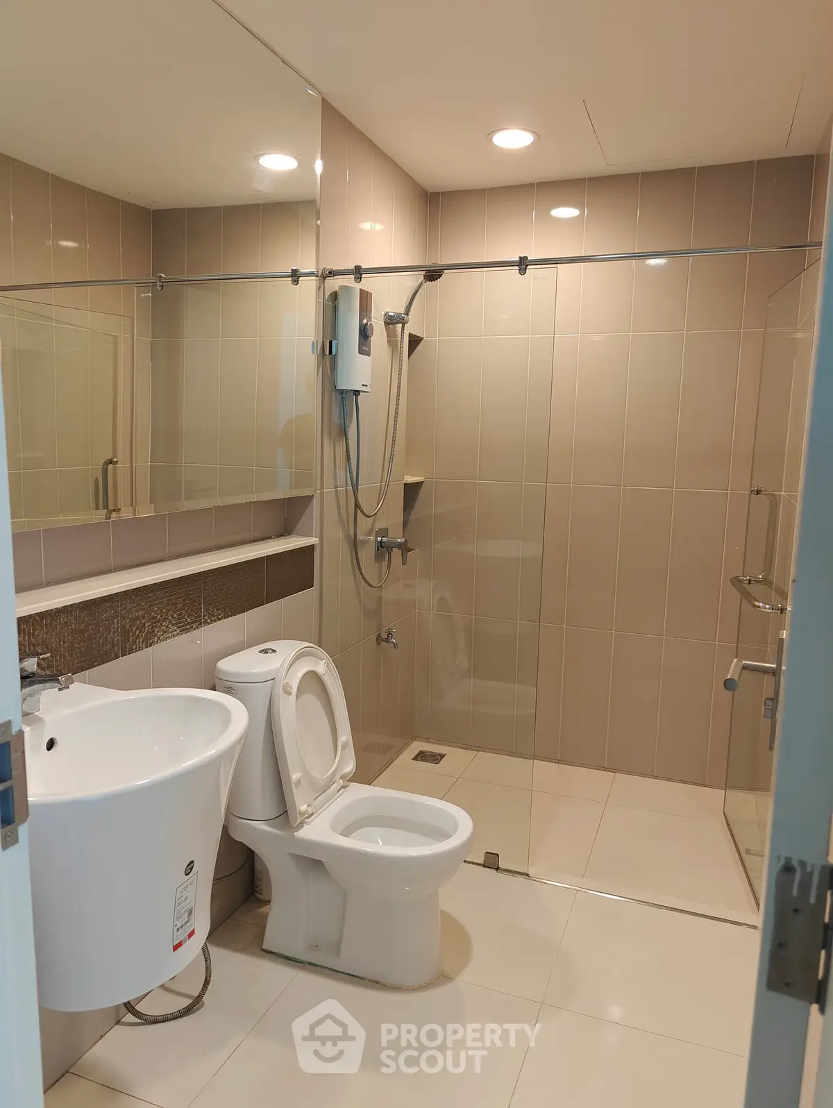 Modern bathroom with sleek fixtures and glass shower enclosure