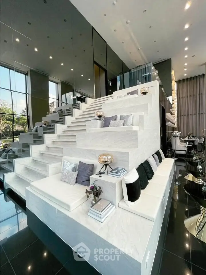 Luxurious modern living room with unique tiered seating and elegant decor