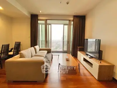 Spacious living room with modern furniture and balcony view