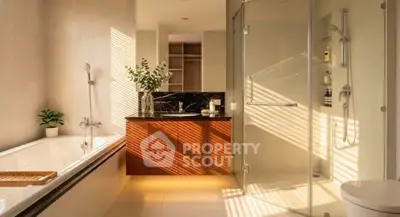 Luxurious bathroom with modern fixtures, glass shower, and elegant bathtub.