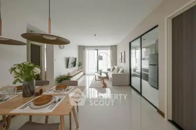 Modern open-plan living and dining area with stylish decor and natural light.