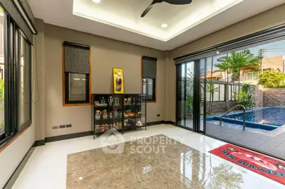 Spacious living room with pool view and modern decor