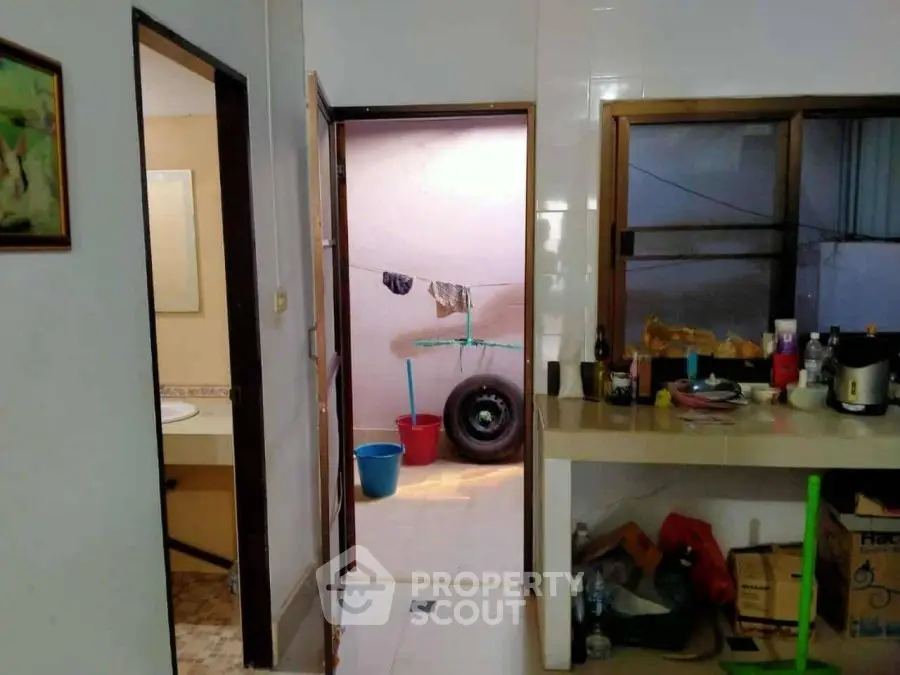 Cozy kitchen with open layout and adjacent utility area