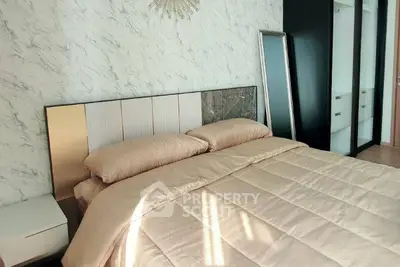 Luxurious bedroom with elegant decor and ample natural light