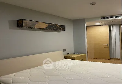 Modern bedroom with stylish decor and comfortable mattress in a contemporary apartment.