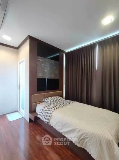 Cozy bedroom with modern decor and wooden flooring