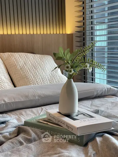 Cozy bedroom with stylish decor and natural light