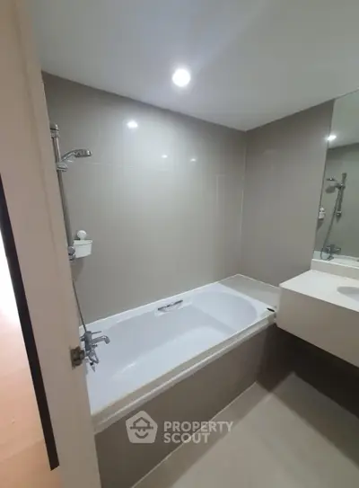 Modern bathroom with sleek bathtub and elegant fixtures