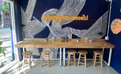 Chic noodle bar interior with modern decor and wooden seating, perfect for casual dining.