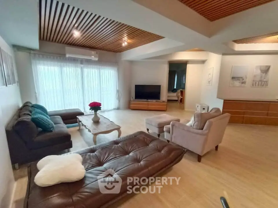 Spacious living room with modern furniture and natural light