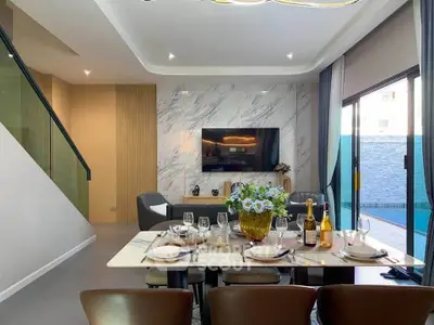 Luxurious modern living room with elegant dining setup and stylish decor