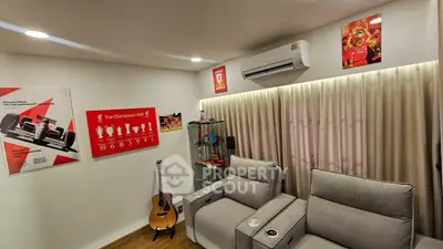 Cozy living room with modern recliners and sports-themed decor.