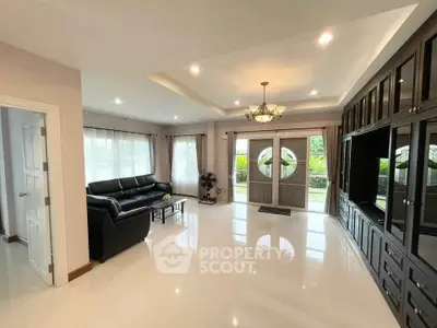 Spacious living room with elegant decor and large windows for natural light.