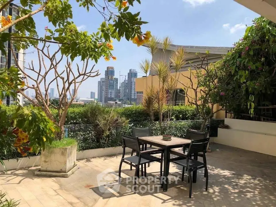 Stunning rooftop garden with city views and outdoor seating area.