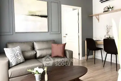 Modern living room with stylish decor and cozy seating area in a contemporary apartment.