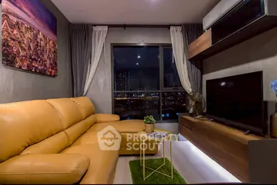 Modern living room with stylish decor and city view, featuring a cozy leather sofa and sleek entertainment unit.