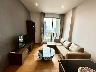 Modern living room with sleek furniture and city view from balcony, perfect for urban living.