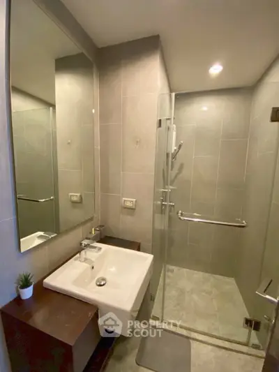 Modern bathroom with glass shower and sleek sink design