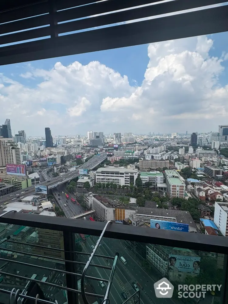 Stunning cityscape view from high-rise balcony with expansive skyline and urban landscape.