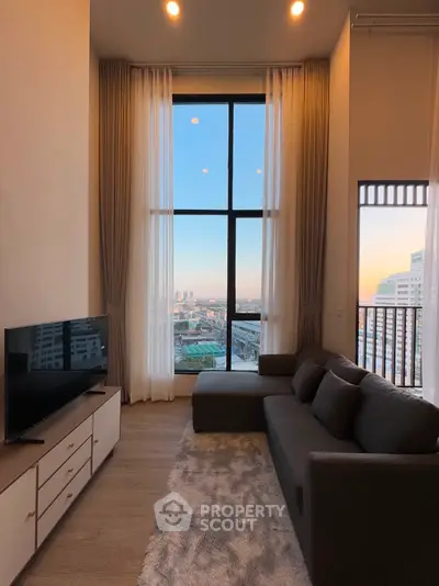 Luxurious high-rise living room with floor-to-ceiling windows and stunning city view