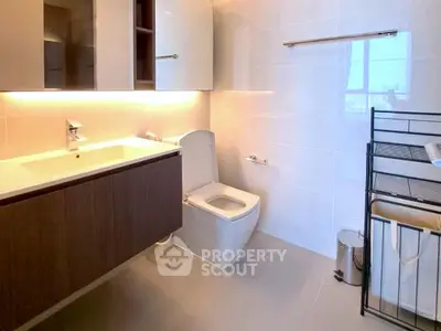 Modern bathroom with sleek fixtures and ample storage space