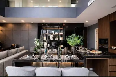 Luxurious modern living room with elegant dining setup and stylish decor