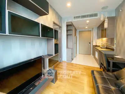 Modern living room with sleek furniture and open kitchen layout