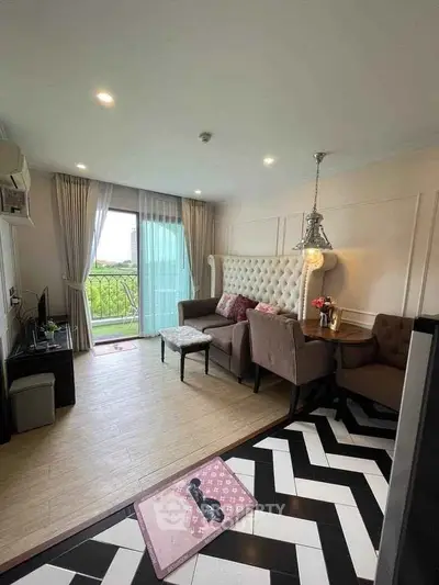 Chic living room with stylish decor and balcony view in modern apartment.