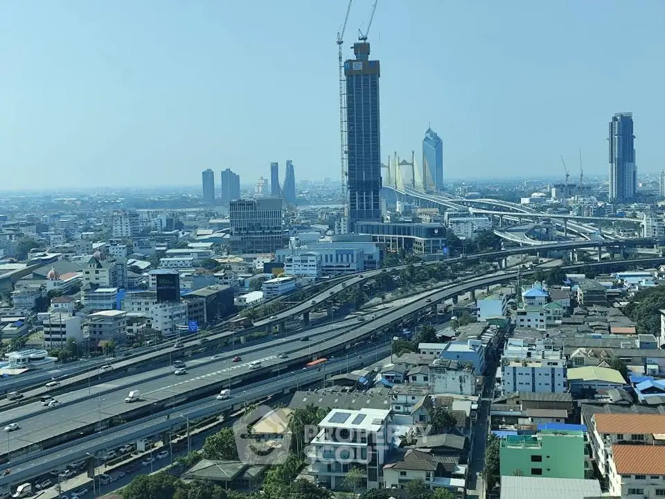 Stunning cityscape view showcasing modern skyscrapers and bustling highways.