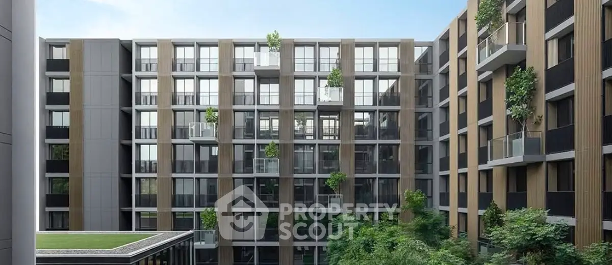 Modern apartment building with lush greenery and spacious balconies