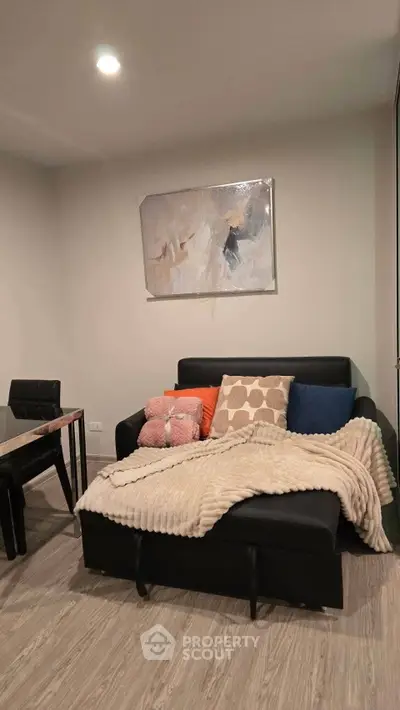 Cozy living room with modern decor and comfortable seating, perfect for relaxation.